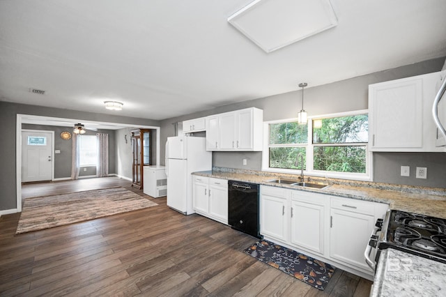 kitchen with black dishwasher and white cabinetry