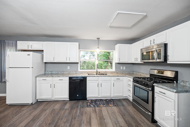 kitchen featuring white cabinets, appliances with stainless steel finishes, sink, and dark hardwood / wood-style flooring