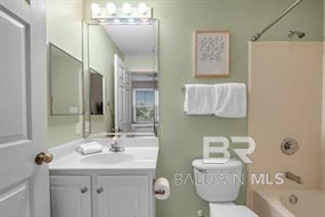 full bathroom featuring shower / bathing tub combination, toilet, and vanity