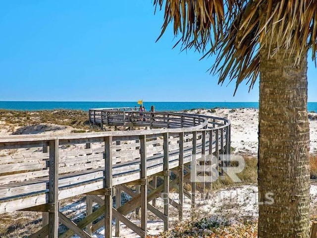 view of property's community with a view of the beach and a water view