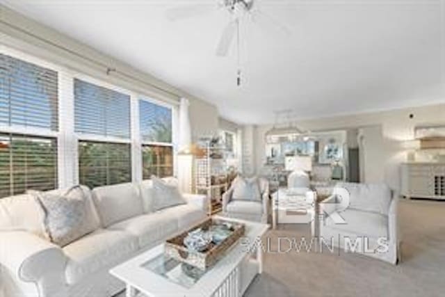 living room featuring ceiling fan and light colored carpet