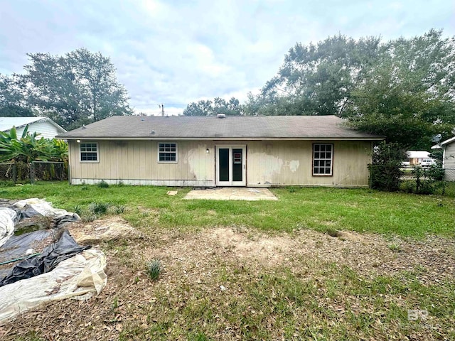 back of house with a yard