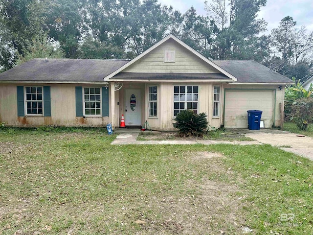 single story home featuring a garage and a front lawn