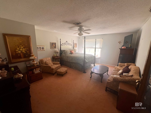 carpeted bedroom with a textured ceiling and ceiling fan