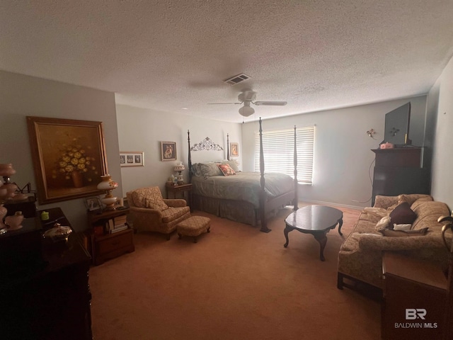 carpeted bedroom with ceiling fan and a textured ceiling