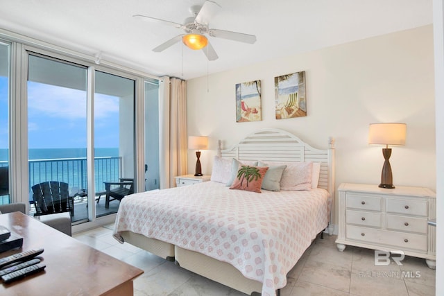 bedroom with access to exterior, a water view, light tile patterned flooring, expansive windows, and a ceiling fan