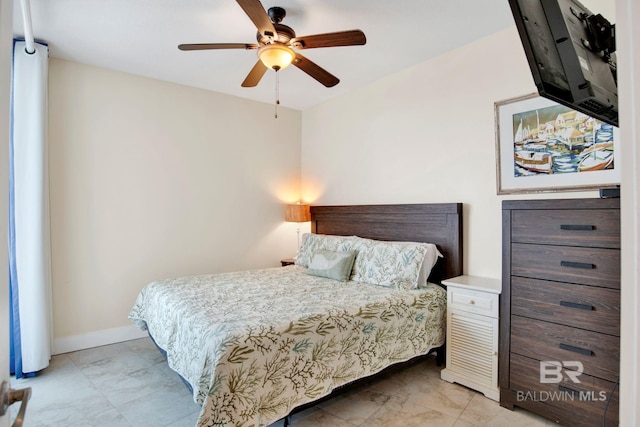 bedroom with baseboards and ceiling fan