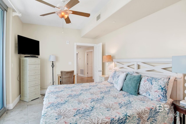 bedroom with ceiling fan and baseboards