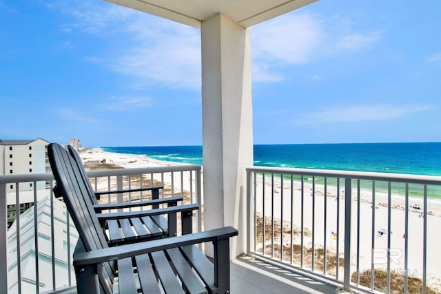 balcony featuring view of water and beach