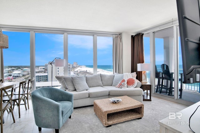 living area with a water view and plenty of natural light