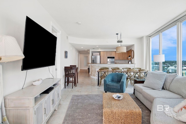 living room featuring recessed lighting and light tile patterned flooring