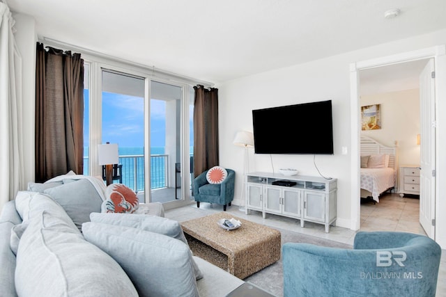 living room featuring light tile patterned flooring and baseboards