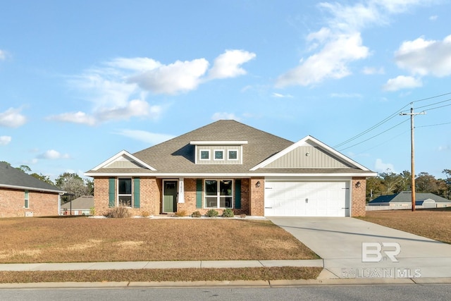 craftsman-style house featuring a front lawn and a garage