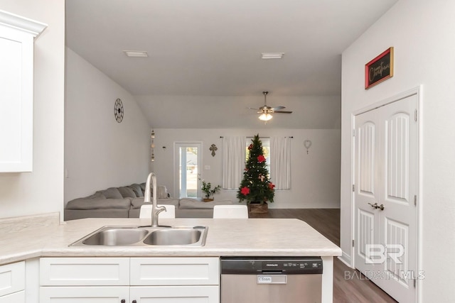 kitchen featuring dishwasher, white cabinets, dark hardwood / wood-style floors, and sink