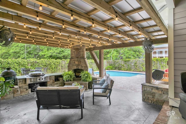 view of patio with a fenced in pool, an outdoor living space with a fireplace, and grilling area