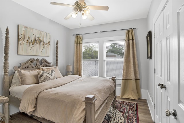 bedroom featuring hardwood / wood-style floors, a closet, and ceiling fan