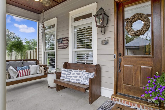 entrance to property featuring covered porch