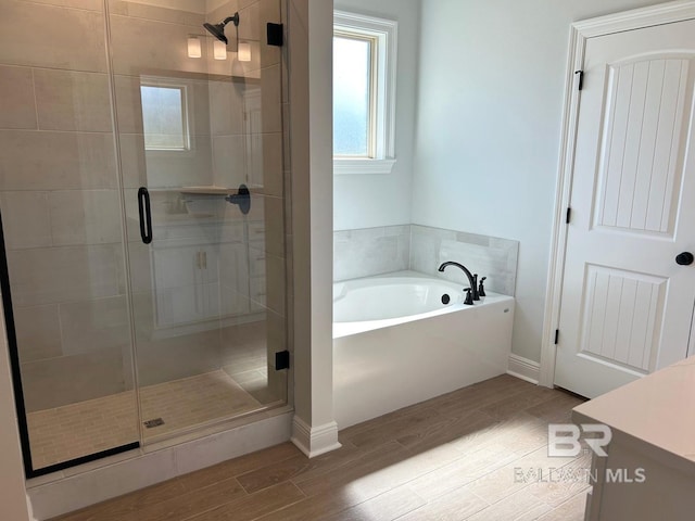 bathroom featuring vanity and plus walk in shower