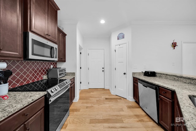 1246 Pembroke Way, Foley, AL 36535 - kitchen with stainless steel appliances, crown molding, backsplash, light wood-type flooring, and light stone countertops