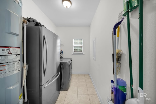 1246 Pembroke Way, Foley, AL 36535 - laundry room featuring electric water heater, washer and dryer, and light tile patterned floors