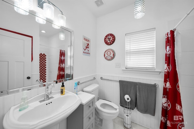 1246 Pembroke Way, Foley, AL 36535 - bathroom with wainscoting and a shower with shower curtain