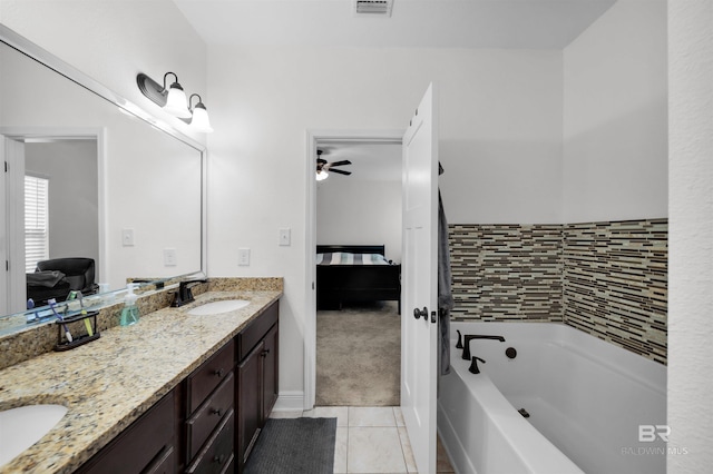 1246 Pembroke Way, Foley, AL 36535 - ensuite bathroom featuring a tub to relax in, tile patterned flooring, double vanity, and a ceiling fan