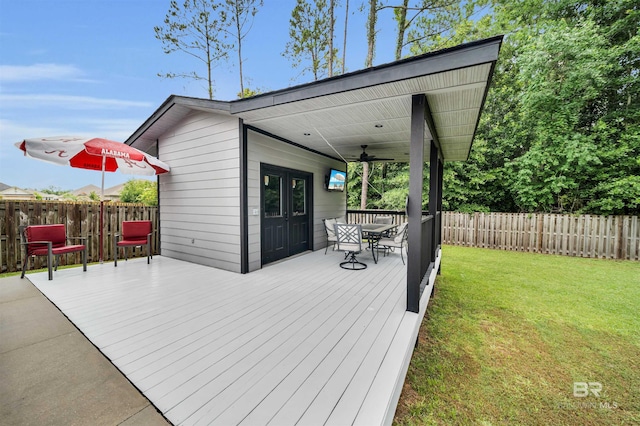 1246 Pembroke Way, Foley, AL 36535 - wooden deck with a ceiling fan, a fenced backyard, and outdoor dining space