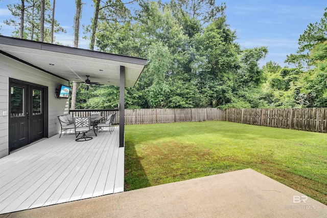1246 Pembroke Way, Foley, AL 36535 - fenced backyard featuring outdoor dining space, ceiling fan, and a wooden deck