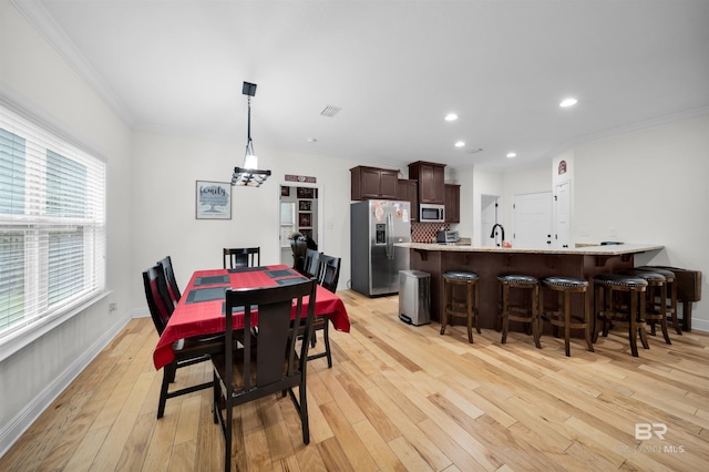 1246 Pembroke Way, Foley, AL 36535 - dining area with light wood finished floors, crown molding, and recessed lighting