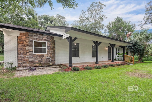 single story home with a front yard and a porch