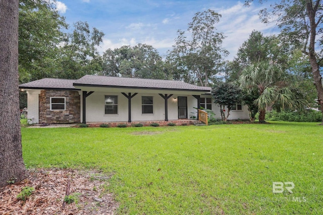 ranch-style home featuring a front yard and a porch