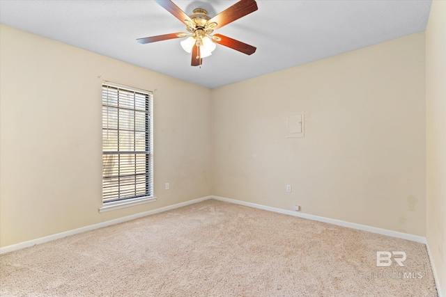 unfurnished room featuring ceiling fan, baseboards, and light colored carpet