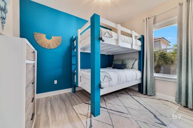 3214 Dolphin Dr, Gulf Shores, AL 36542 - bedroom with wood finished floors and baseboards