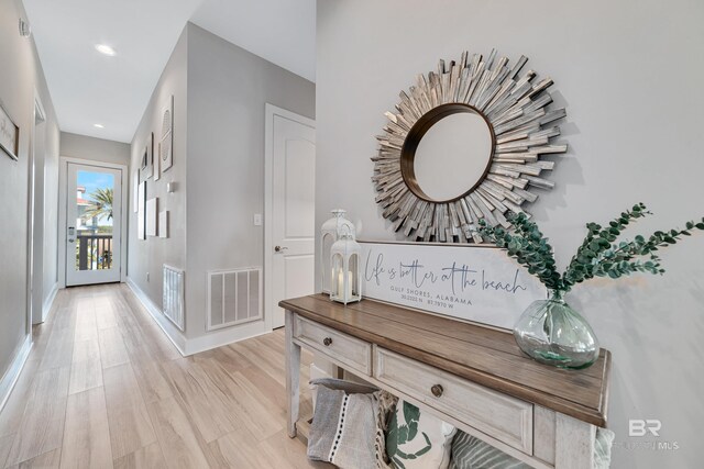 3214 Dolphin Dr, Gulf Shores, AL 36542 - hall with visible vents, baseboards, and light wood-style floors