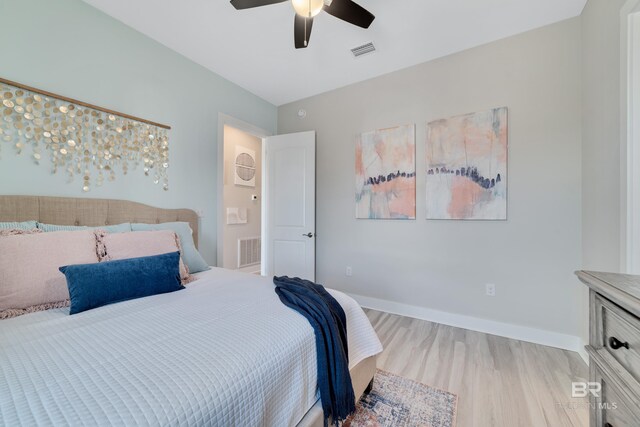 3214 Dolphin Dr, Gulf Shores, AL 36542 - bedroom featuring visible vents, baseboards, and wood finished floors