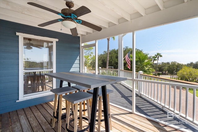 wooden deck featuring ceiling fan