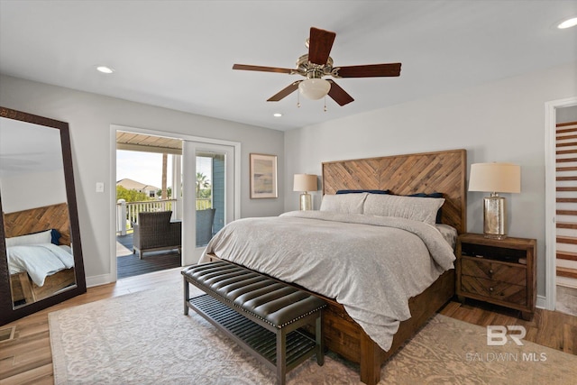 bedroom with access to exterior, light hardwood / wood-style flooring, and ceiling fan