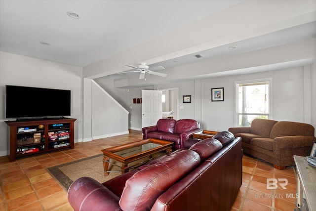 tiled living room with ceiling fan