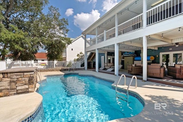 view of swimming pool featuring outdoor lounge area and a patio