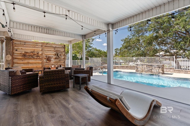 view of pool featuring an outdoor living space and pool water feature