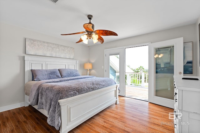 bedroom featuring access to outside, light wood-type flooring, and ceiling fan