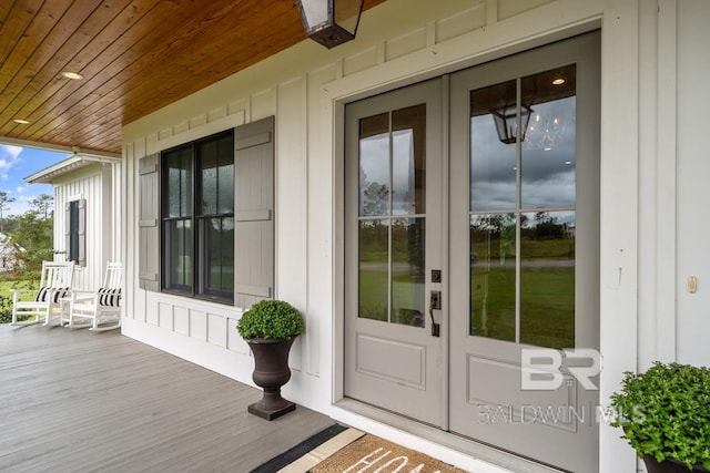 21151 Caveletti Cir, Fairhope, AL 36532 - property entrance with french doors and board and batten siding