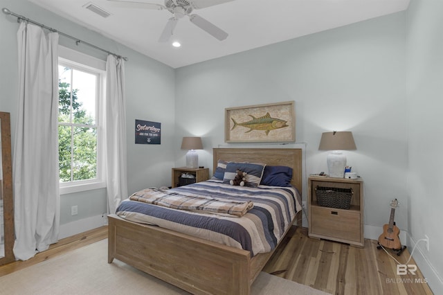 21151 Caveletti Cir, Fairhope, AL 36532 - bedroom featuring wood finished floors, multiple windows, recessed lighting, and a ceiling fan