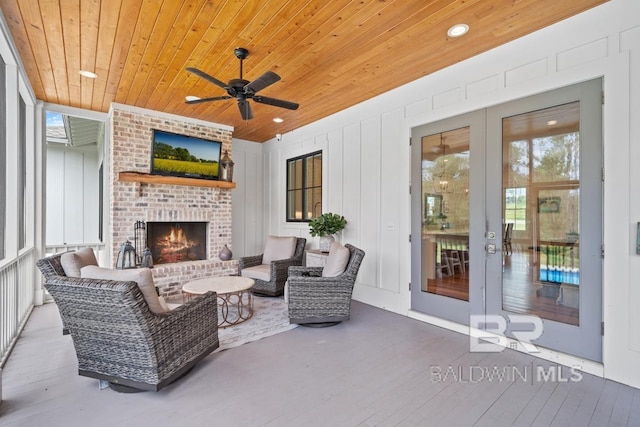 21151 Caveletti Cir, Fairhope, AL 36532 - view of patio / terrace with ceiling fan and an outdoor living space with a fireplace