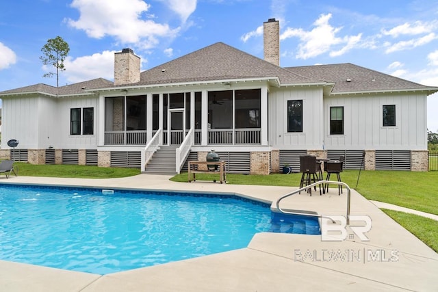 21151 Caveletti Cir, Fairhope, AL 36532 - outdoor pool with a sunroom, a yard, and a patio area