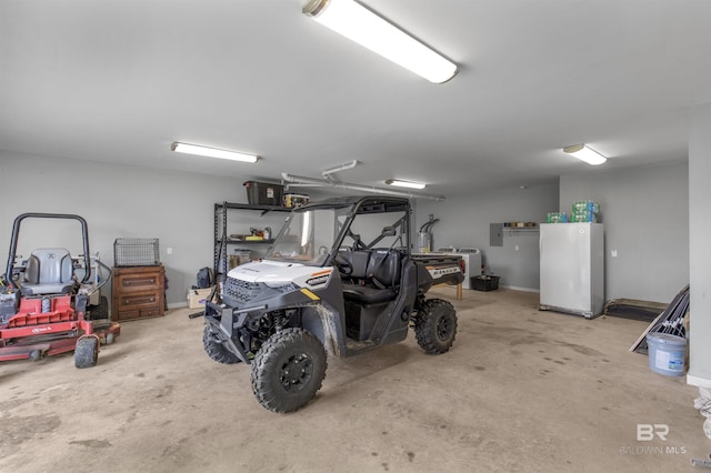 21151 Caveletti Cir, Fairhope, AL 36532 - garage featuring electric panel and freestanding refrigerator