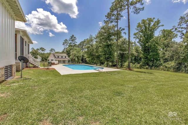 21151 Caveletti Cir, Fairhope, AL 36532 - swimming pool featuring a yard, a patio area, and view of wooded area