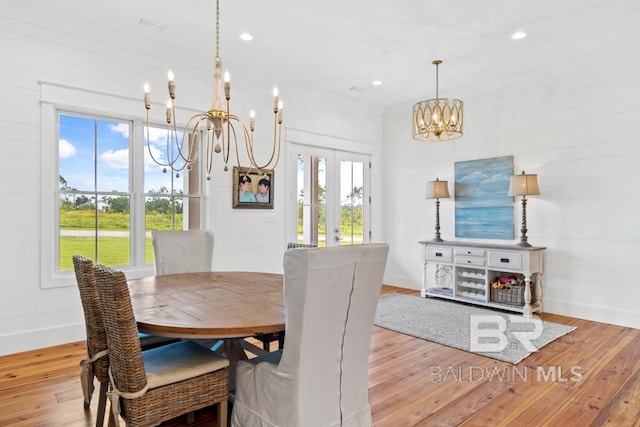 21151 Caveletti Cir, Fairhope, AL 36532 - dining area featuring a chandelier, hardwood / wood-style flooring, french doors, and recessed lighting