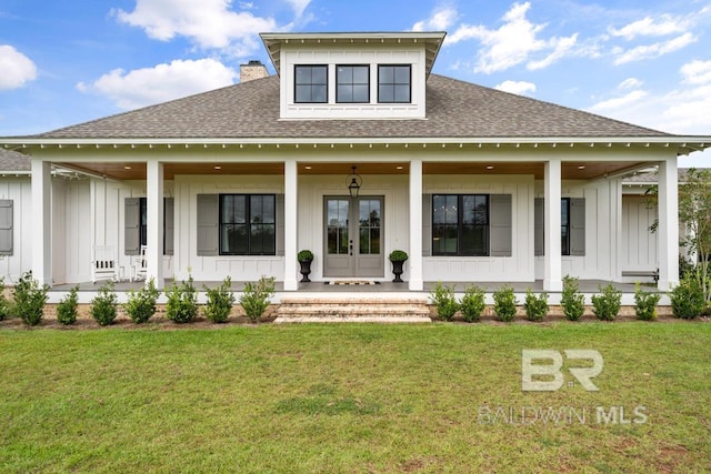 21151 Caveletti Cir, Fairhope, AL 36532 - rear view of property with board and batten siding, a shingled roof, and covered porch