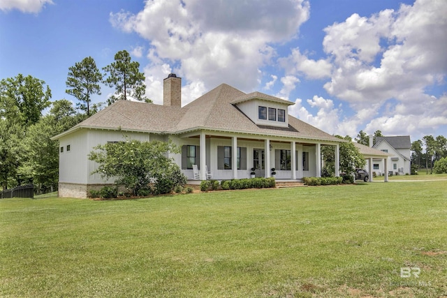 21151 Caveletti Cir, Fairhope, AL 36532 - view of front of house featuring a chimney, covered porch, a front lawn, and a shingled roof